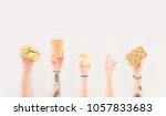 cropped shot of people holding... | Shutterstock . vector #1057833683