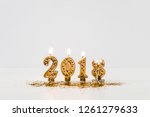 burning 2018 candles and golden ... | Shutterstock . vector #1261279633