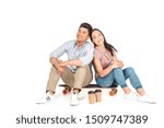 Small photo of chappy asian couple sitting on longboard and smiling at camera on white background
