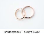 two golden wedding rings isolated on white, wedding rings background concept