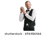 handsome smiling bartender with classical metal shaker isolated on white