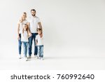 Happy Young Family In White T...