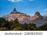 Small photo of Elegant and eye catchy mountain peak touches blue sky with clouds. Trees in the mountain with little haze in atmosphere.