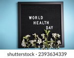 Small photo of Inscription International Day of Health. Lettering board with white platonic letters Health care clinic background. World health day