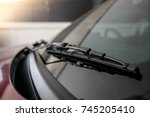 A windscreen wiper or windshield wiper is a device used to remove rain, snow, ice and debris from a windscreen or windshield