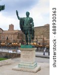 Small photo of ROME, ITALY - JULY 29, 2014: Statua di Nerva (Nero Claudius Caesar Augustus Germanicus) with Forum of Augustus in background