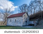 Small photo of Donji Matejevac, Serbia - February 21. 2022 Sveta Petka small the unassuming orthodox church made of stone in a forest valley on a sunny spring day
