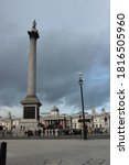 Small photo of London, UK - August 10, 2019: Nelson Column in Trafalgar Square in London. Monument column built to commemorate Admiral Horatio Nelson, who died at Battle of Trafalgar in 1805 popular tourist travel