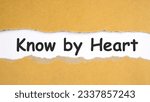 Small photo of know by hAbstract word know by heart label torn paper recycled brown pieces on white background. Old kraft ripped paper scrap box craft banner alphabet know by heart pattern.eart
