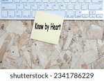Small photo of Know by heart ask writing text post it paper in office on laptop computer keyboard. Message know by heart concept. top view.