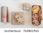Gifts in brown craft paper wrapped scandinavian style and a glogg set. Prepare mulled wine and get gifts for your friends ready!