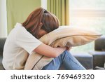 asian teenage feeling depressed and lonely in the house. Stressed female from university study.