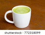 Hot green tea latte in white...
