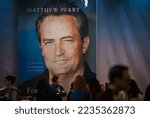 Small photo of Bucharest, Romania - December 07, 2022: A large banner of Matthew Perry book "Friends, Lovers, and the Big Terrible Thing: A Memoir" at Gaudeamus book fair