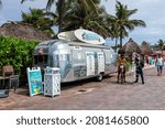 Small photo of Hollywood, USA - August 4, 2021: Hollywood beach broadwalk walkway in Miami, Florida and vintage retro metal tin restaurant food truck airstream and sign for Floridays Tacos