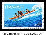 Small photo of USA, CIRCA 2009: a postage stamp printed in USA showing an image of a surfer an people in canoe dedicated to Hawaii statehood, circa 2009.