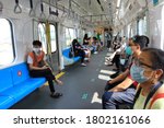 Small photo of Jakarta, Indonesia - August 20th, 2020: All passengers wearing face mask inside the MRT. Health protocols applied due to Covid-19 pandemic