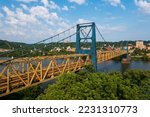 This is an afternoon view of the historic Market Street Bridge, a wire suspension and Warren through truss over the Ohio River between Weirton, West Virginia and Steubenville, Ohio.