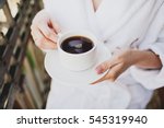 Morning girl drinks coffee