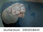 Woman Fist With Woke Written....