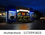 Small photo of Bennington, VT, USA October 15, Twilight starts to glow behind the Blue Benn Diner, a classic railcar diner in Bennington, Vermont