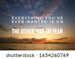 Blurry seascape with Inspirational quote - Everything you've ever wanted is on the other side of fear