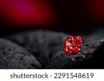 Red sapphire gemstone on black...