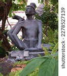 Small photo of Bangkok, Thailand- 8 March 2023 : Contorted hermit at Wat Pho, posture 46 Contortion to relieve side stinging symptoms.