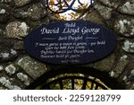 Small photo of LLANYSTUMDWY, WALES UK – NOVEMBER 21: Liberal Prime Minister David Lloyd George plaque close up. Designed by Clough Williams-Ellis. Llanystumdwy , Criccieth, North Wales, UK, landscape Gwynedd, UK