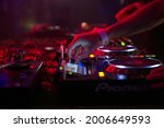 Small photo of Close-up of a deejay's hand while mixing