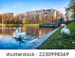 Small photo of Patriarch's Ponds on an autumn sunny day and white swans, Moscow