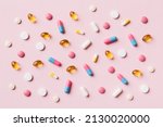 Many different pills and space for text on colorful background, top view. Different pills on color background, flat lay.
