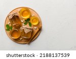 Small photo of honey jar with acacia flowers and leaves. fresh honey top view flat lay.