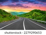 Small photo of Highway landscape at colorful sunset in summer. Mountain road landscape at dusk. Beautiful nature scenery in green mountains. Travel landscape for summer vacation on highway. Bavaria, Germany.