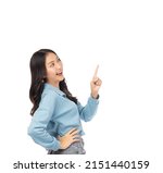 Small photo of Beautiful young Asian woman pointing up to copy space and looking up with smile face and happy Pretty girl act like a satisfied product, use for advertising with isolated on white background