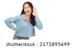 Small photo of Happy young asian woman try to hearing you overhear listening sound to gossip looking at camera isolated on white background and copy space Studio shot hearing gesture get good news with smile face