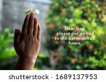 Dear God, please put an end to the Coronavirus. Amen. With young woman clenched hands holding flower in prayer gesture. Pray to stop the spread of corona virus covid-19 concept.