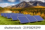 Small photo of Solar panels autumn landscape. Renewable energy supply. Solar panels next to forest and mountains. Photoelectric energy supply. Solar farm electricity panels. Eco-friendly source electricity.