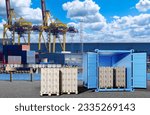 Small photo of Sea cargo harbor. Pallets with boxes in port. Preparation of cargo for sea transportation. Ship's container is on shore. Harbor with cargo cranes. Seaport in sunny weather. Logistics harbor