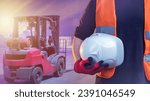 Small photo of Helmet in hand of worker. Hardhat for head protection. Cropped hand of storekeeper. Hardhat for security. Forklift driver. Warehouse employee safety concept. Safety helmet for industrial workers