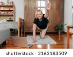 Mature Woman At Home Doing...