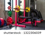 Small photo of Fitness equipment such as barbell, weight plates, various colors for various bench press and dumbbell positions Be prepared for an exercise class that will begin in a few minutes after this.