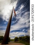 Small photo of Sheboygan, Wisconsin, USA - July 19, 2022: The Acuity Flagpole stands 400 feet tall and flies a 9,800 square foot flag weighing 250 pounds with stripes five feet high and stars over three feet wide.