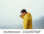 Male Hiker In A Yellow Jacket...