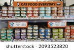 Small photo of Newcastle, Australia - Dec 2021: View of varous flavour canned Fancy Feast Wet Cat Food (cod, sole and shrimp favour canned food) in can on the shelf at local pet store or local supermarket