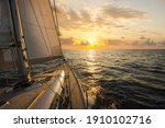 Sailboat sailing in the Mediterranean Sea at sunset