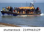 Small photo of Dungeness, Kent, UK, April 25th 2022, migrant beach landing in kent. Migrants rescued at sea after crossing the English channel attempting to seek refuge in the UK.