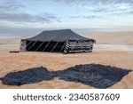 Small photo of Doha, Qatar - December 10, 2022: Tent in the desert, south inland sea of Doha, Qatar