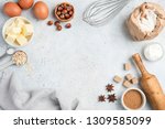 Baking ingredients and utensils on concrete background. Cooking or baking cake, cookies, pastry or bread concept. Top view with copy space for text, recipe, menu