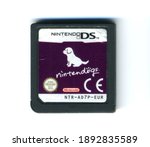 Small photo of London, England, 26.05.20202 Nintendogs nintendo ds video games cartridge isolated on a white background. Vintage retro video racing gaming.